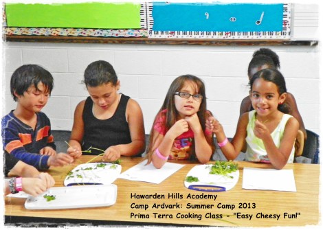Chopping the herbs to flavor the cheese.